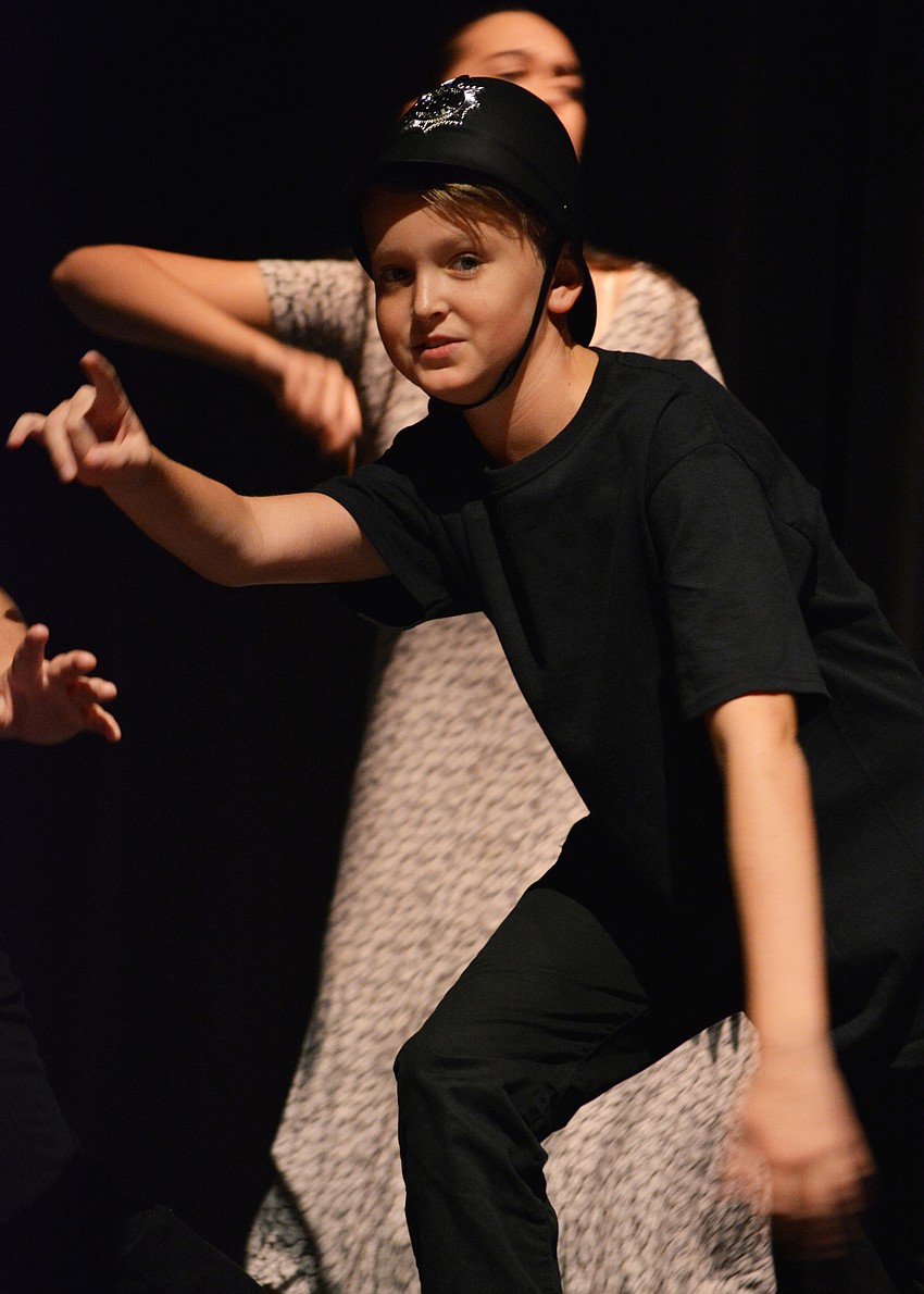 Lucas Parrish, as a cop named Bradley Bobby,  gets ready to arrest James for stealing the giant peach.