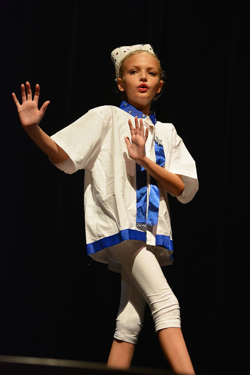 Claire DePasquale, a featured dancer, performs a number as officials prepare to arrest James for stealing the giant peach.