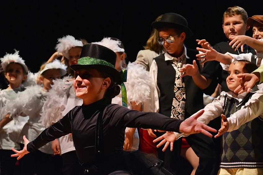 Brooke Palmtage, center, portrays the narrator, Ladahlord.