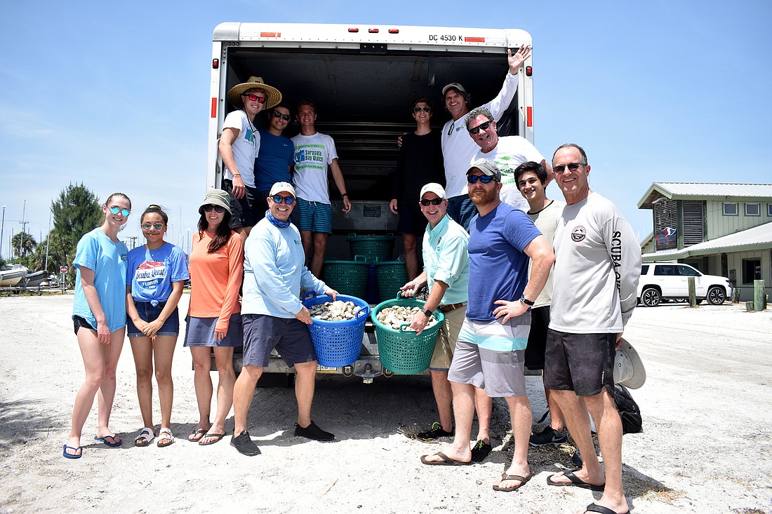 The Sarasota Bay Watch and volunteers released 30,000 clams into Sarasota Bay on June 16, bringing the release total to 125,000.