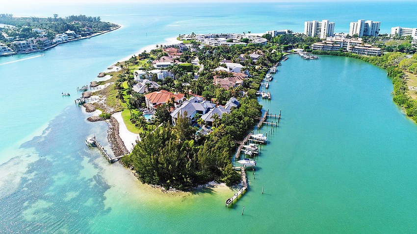15 Lighthouse Point Drive is on Longboat Key's southernmost point overlooking New Pass.