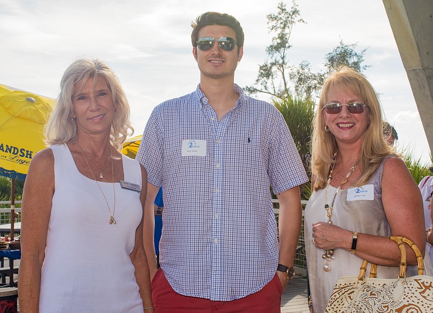 Tana and Drew Darley with Debbie Cole