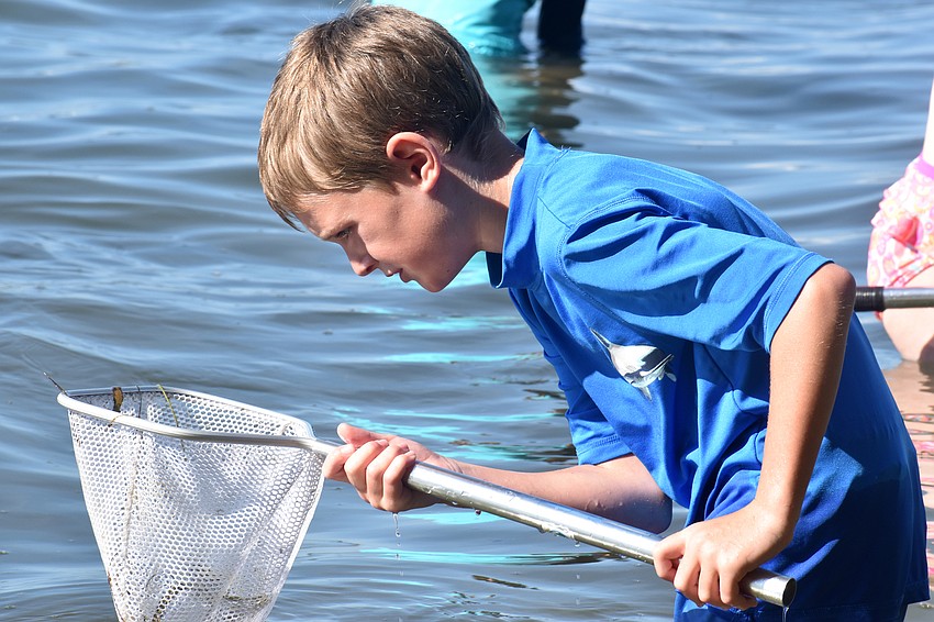 Aiden Putnam scoops up his net.