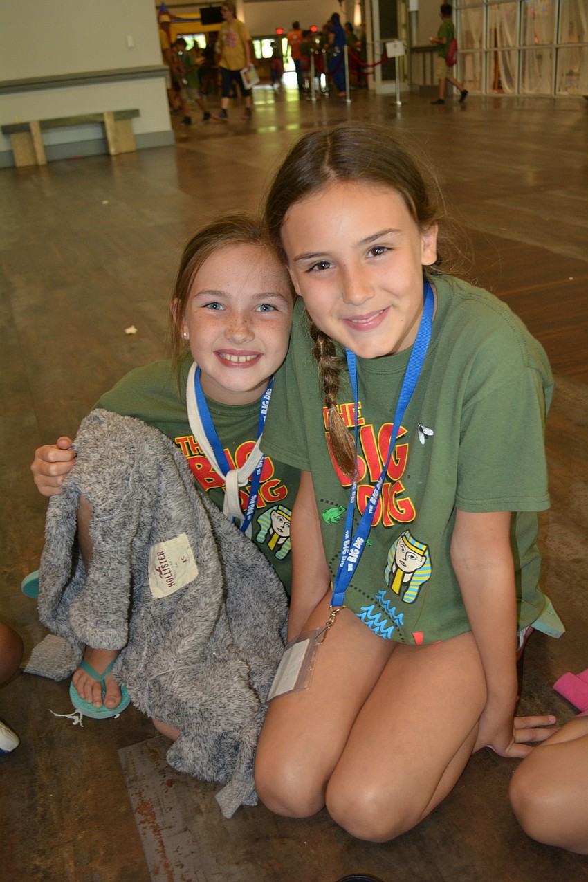 Cami Sandhoff and Kelsey Jerome, both 9, enjoy an afternoon snack of ice cream.