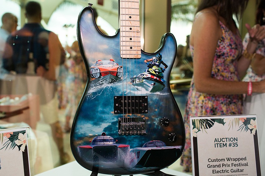 Handmade guitars for the Grand Prix Festival were donated for the auction.