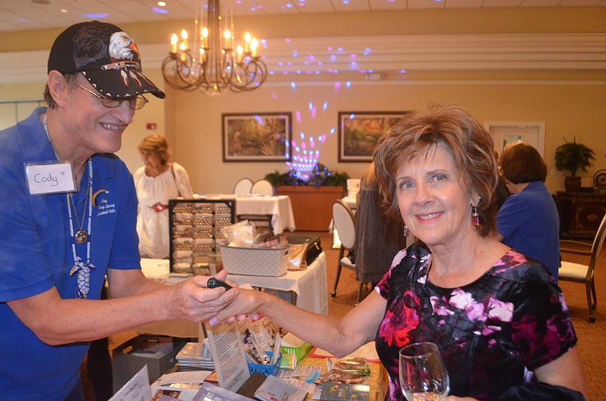 Cody Templeton from Young Living Essential Oils teaches Barb Vincent how a crystal can help her heal herself holistically.