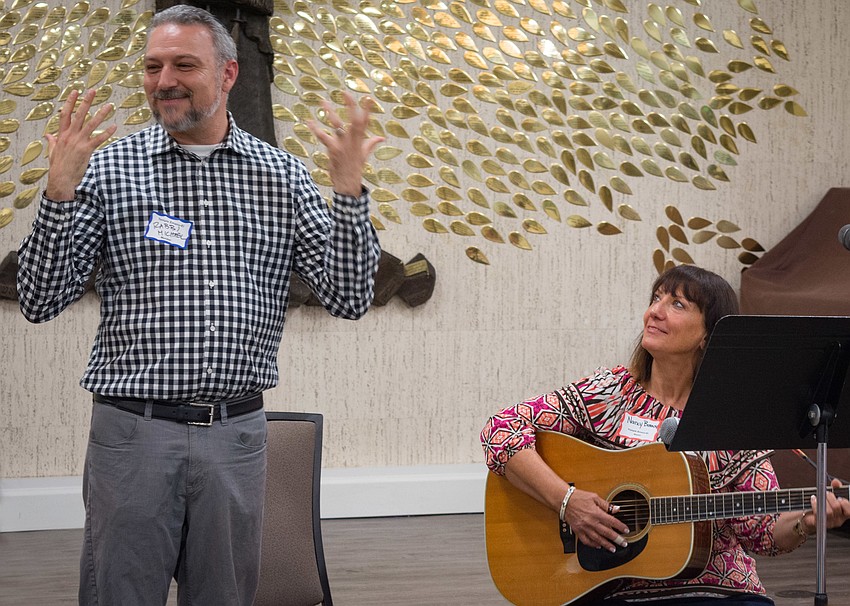 Rabbi Michael Shefrin and Nancy Bossov get the ceremony started.