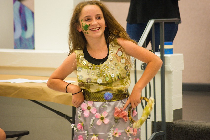 Loudon Dougherty wears an outfit made from soda tablets, plastic gems and fake flowers.