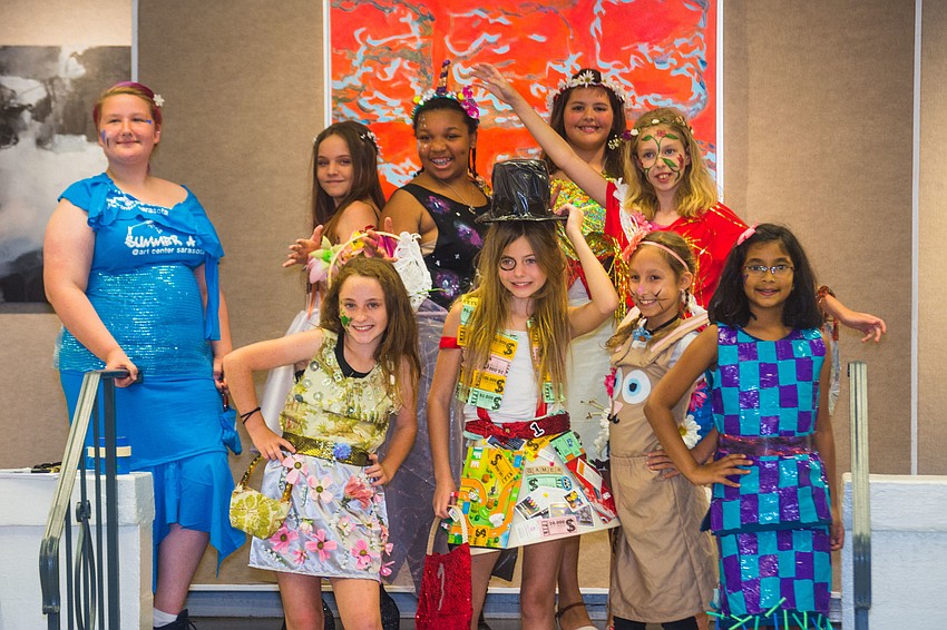 The young designers pose for their friends and family.