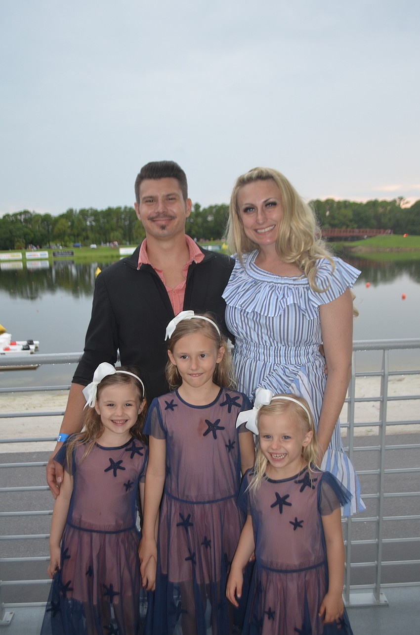 Sarasota's Bill and Tavia Ames wait for the fireworks with their children 6-year-old Thiery, 7-year-old Tinsley and 4-year-old Tascher.