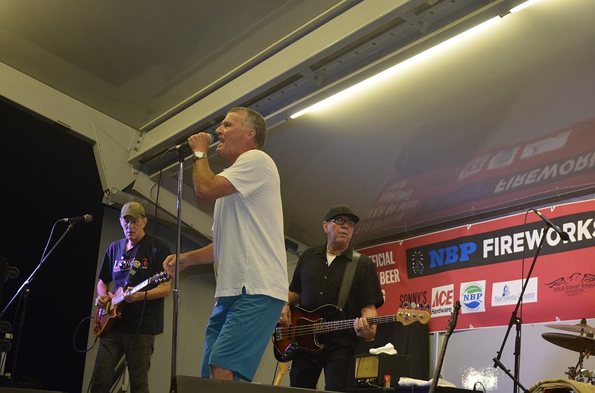 Greg Billings and his band get into their set, which was pushed back due to weather.