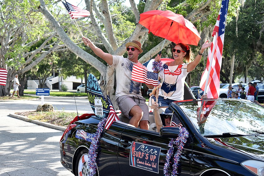 Chad Myers and Joanna Wnuk wave to the crowd.