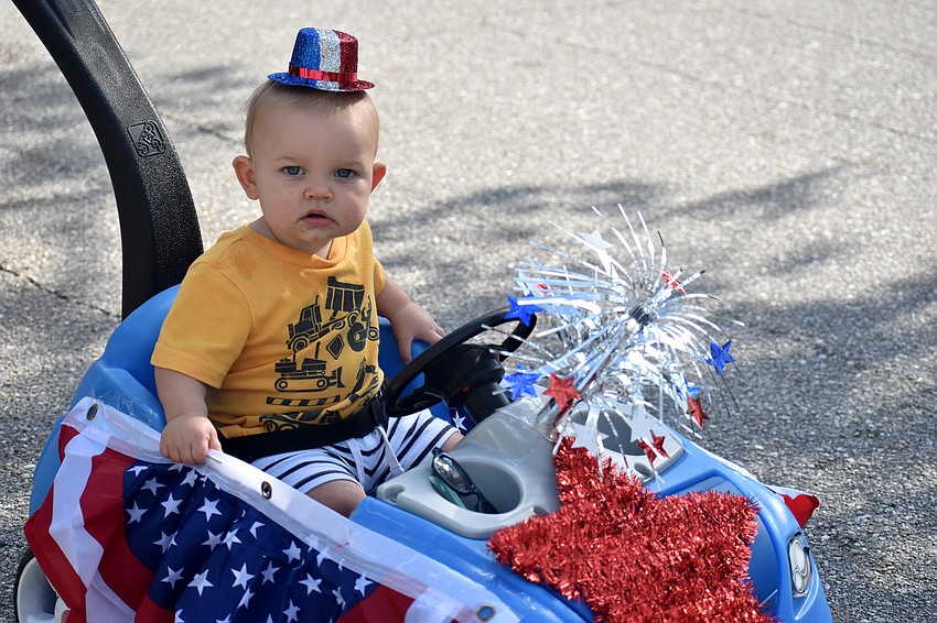Peter Gehan takes a ride through the parade route.
