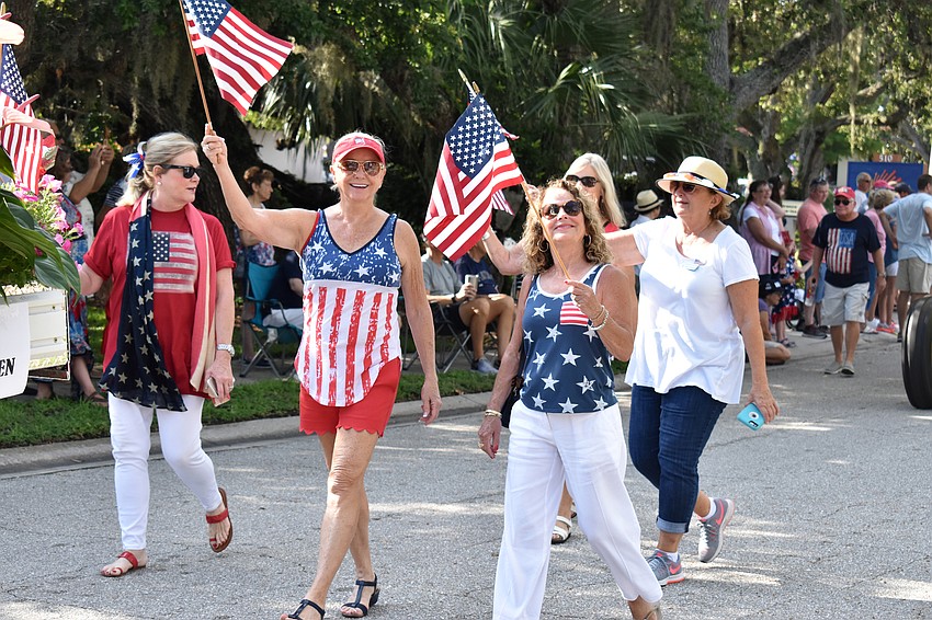 Members of the Longboat Key Garden Club are all smiles as they walk the parade route.