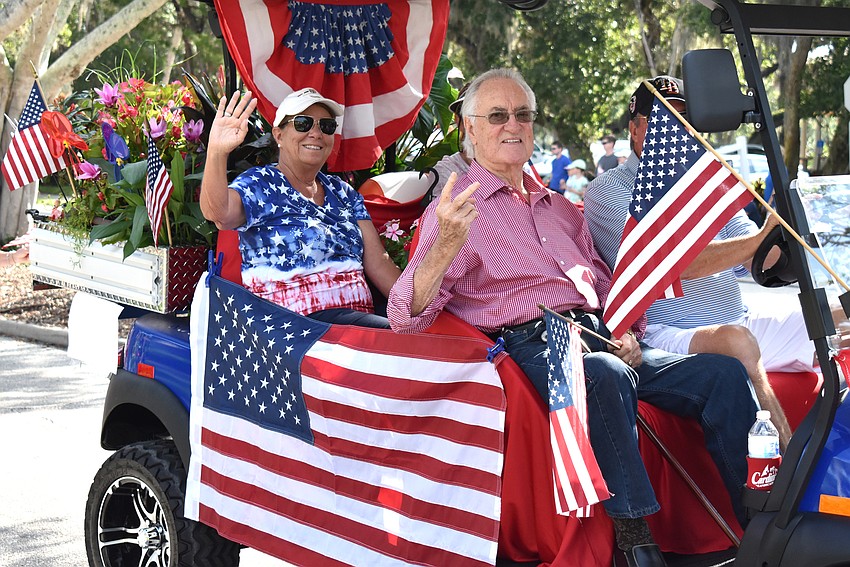 Cathy Bishop and Jack Black wave to the crowd.