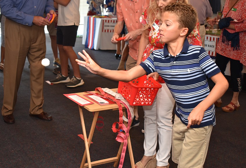 Turner Mitten plays tic tac toe toss.