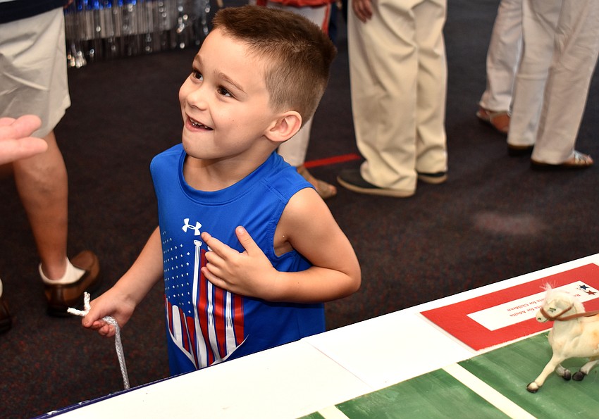 Sterling Nathan is all smiles after his horse reaches the finish line in a game.