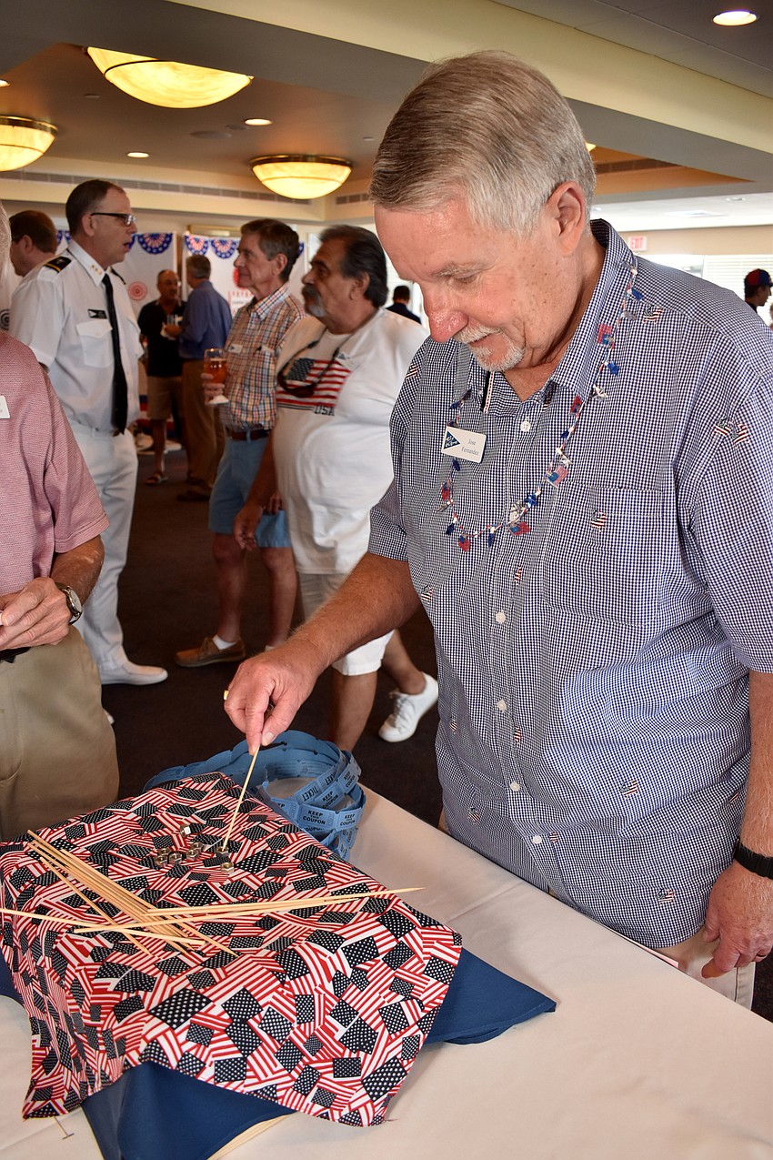 Jose Fernandez races the clock to stack small bolts.