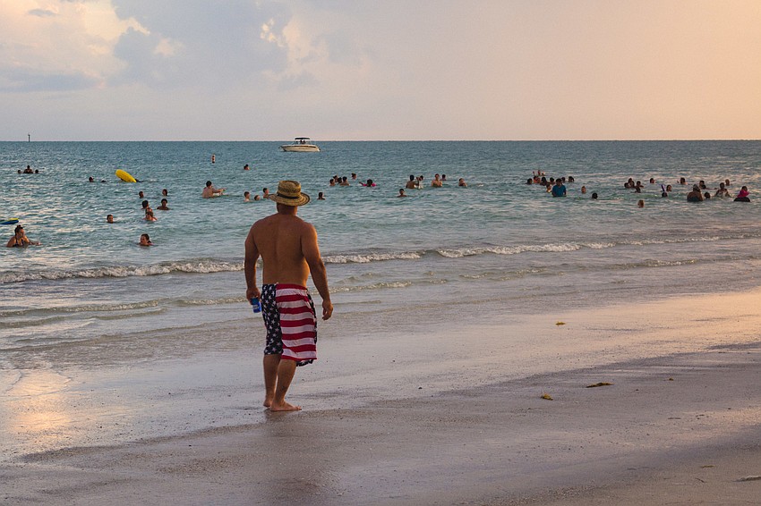 Beachgoers donned their patriotic swimsuits and accessories.