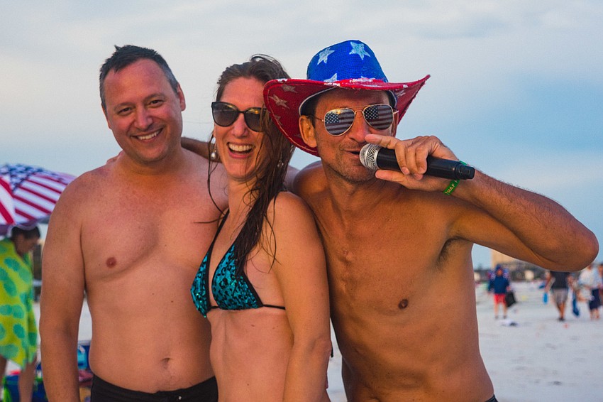 Jared Chromy, Angelique Chromy and DJ Rob Bryja  prepare to get the party started.