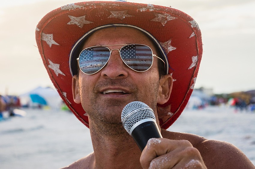 DJ Rob Bryja announces when fireworks will begin.