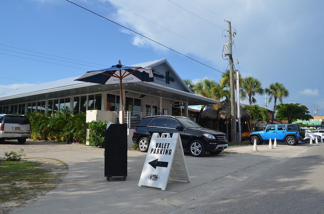 Although residents have complained about cars queuing in the street for valet stands in Siesta Key Village, some people see the parking operations as a helpful tool.