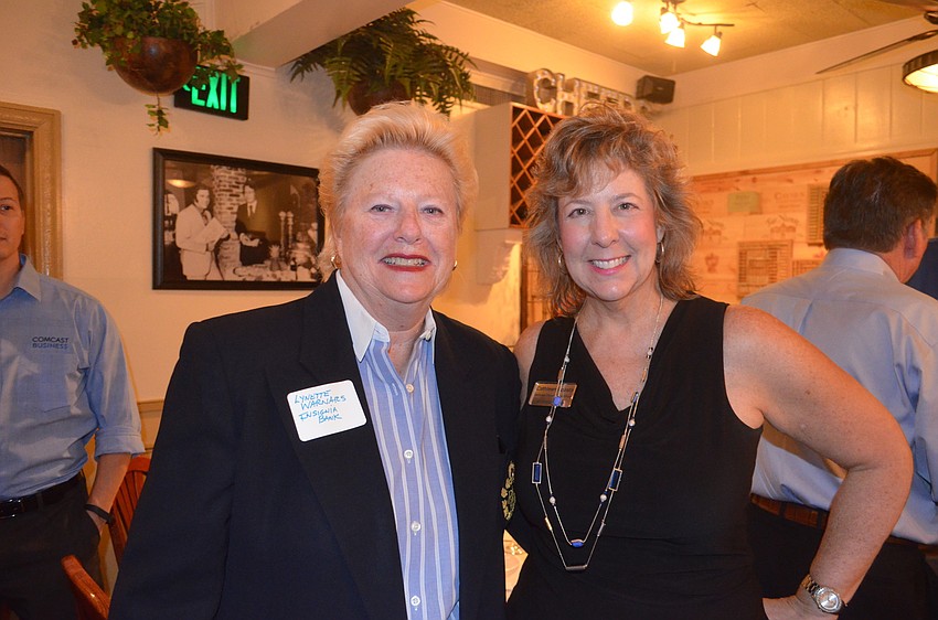 Lynette Warnars, of Insignia Bank, and Cathleen Acosta, of Stewart Tile