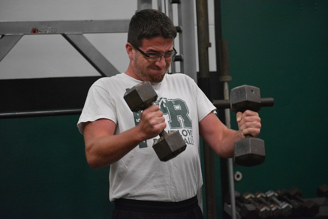 Lakewood Ranch junior Angelo LaFrese gives the bicep curls his all during a voluntary workout.