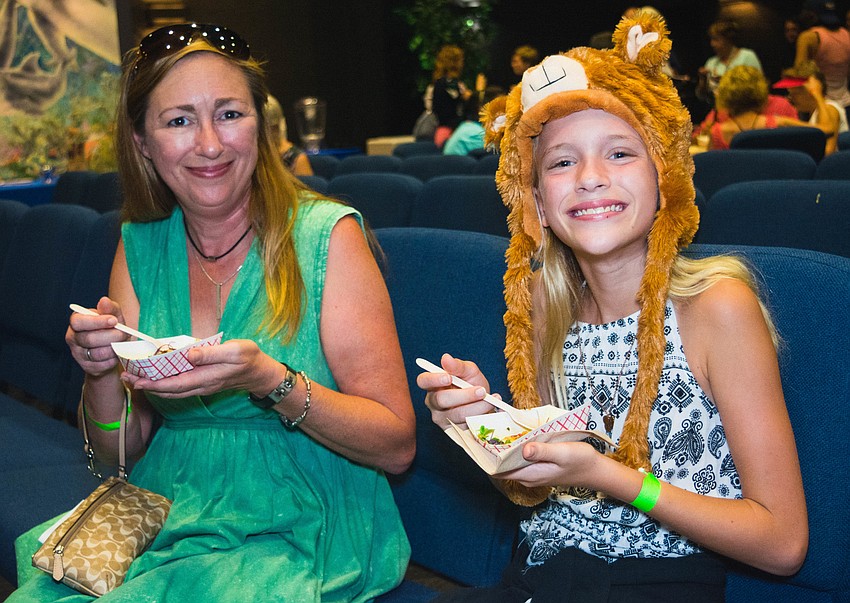 Dawn and Keira  Drumgool enjoy samples of lionfish