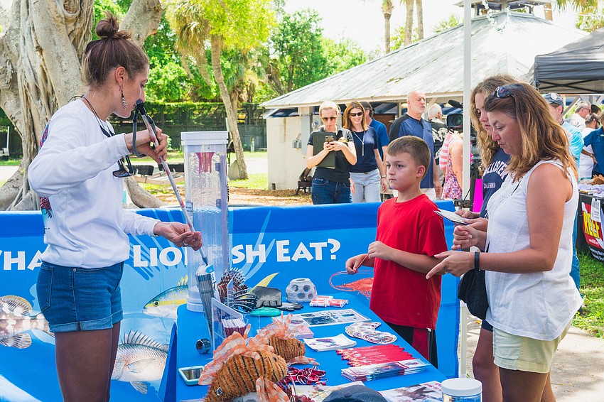 Hannah Tillotson gives a demonstration of how lionfish are caught.