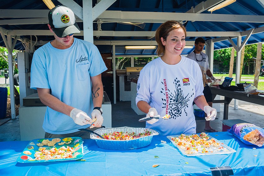 Cody Cole and Lisa Burton serve up lionfish ceviche.