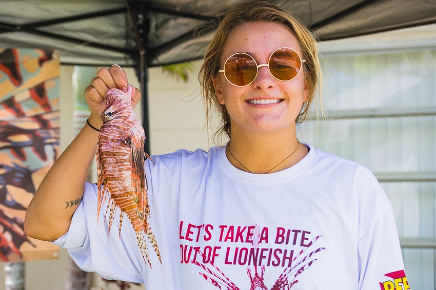Gabby Magalski holds up one of the many lionfish harvested