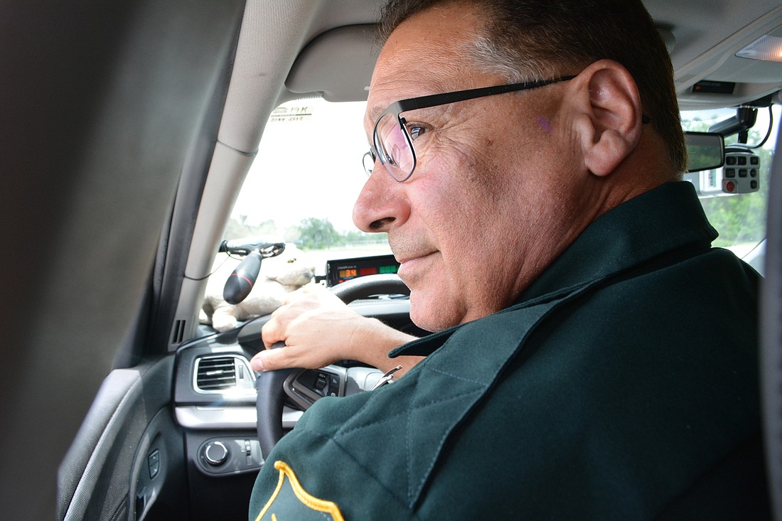 Sgt. Mike Kenyan uses radar to track speed of vehicles traveling along Lakewood Ranch Boulevard. The radar equipment can monitor speeds both in front and behind his patrol car and even while he is moving.