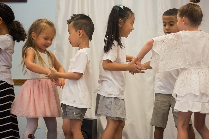 The campers perform a dance routine.