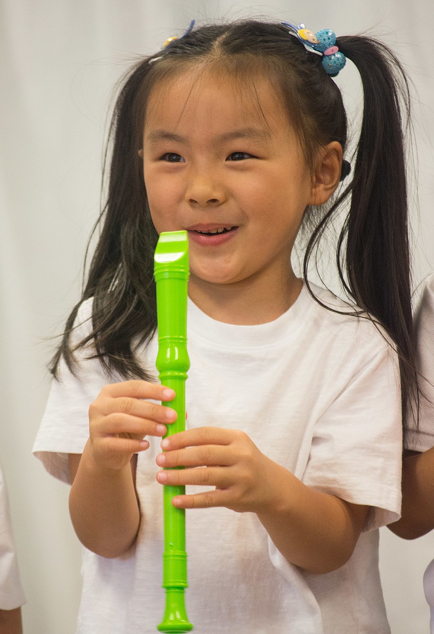 Tiffany Chen plays a recorder.