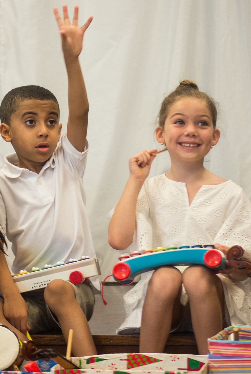 Blake Brown and Fiona Quinto-Halt show off what they have learned during the music camp.