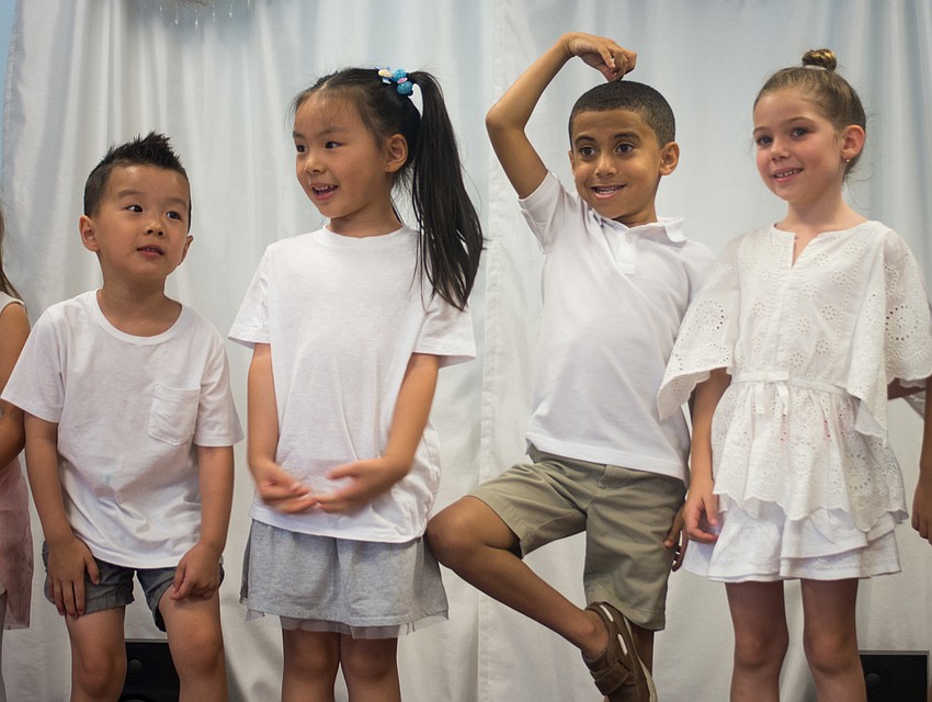The campers perform a dance routine.
