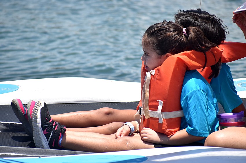 Amaris Marenco and Adamarys Davila, accompanied by Sarasota Youth Sailing coaches, sail around Sarasota Bay.