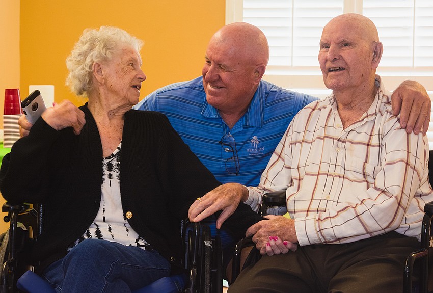 Barbara and Ivan Perkins with their eldest son, Dick Perkins, center.