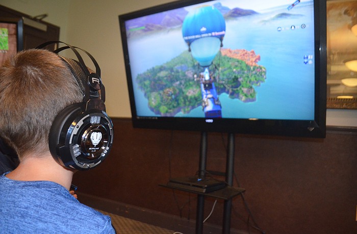 Jacob Jones, 12, from Greenbrook, watches as his player parachutes down to begin his second game.