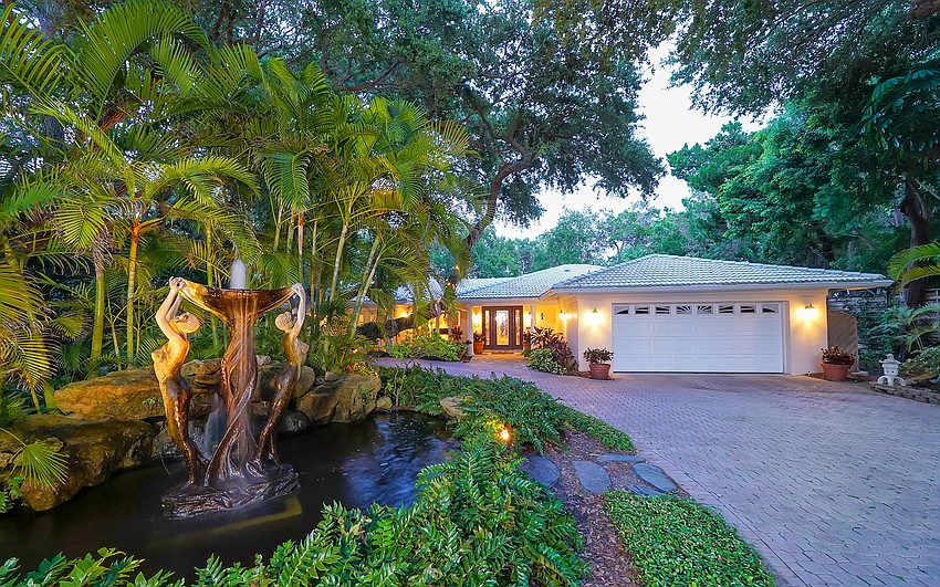 The main home features botanical gardens around the property.