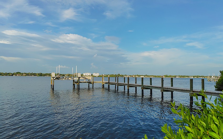 The main home features a private dock with a boat lift.