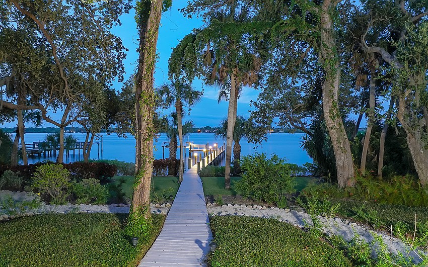 The main home features a private dock with a boat lift.