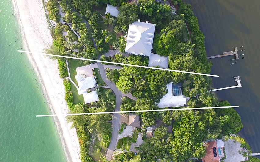The three-home estate spans from the gulf to the bay.