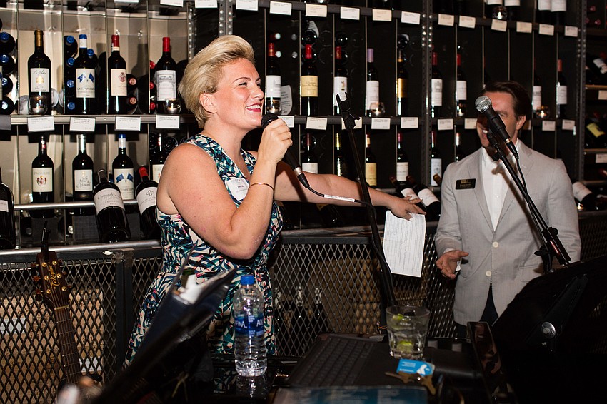 Laura McMamus-Mesia welcomes guests to the launch party.