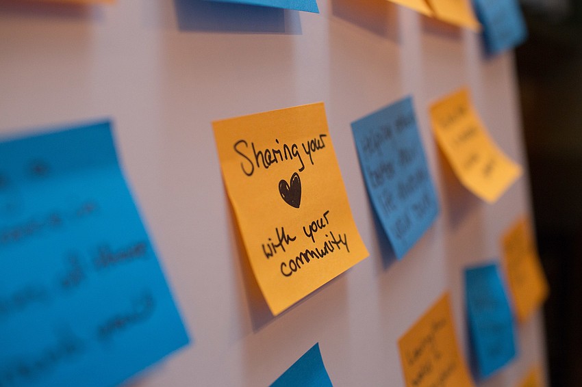 Attendees filled out a sticky note with what they think philanthropy means.