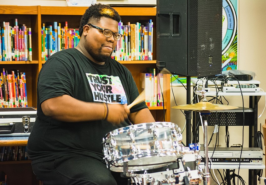 Drummer Simeon Bishop Moore performs for students at Alta Vista Elementary.