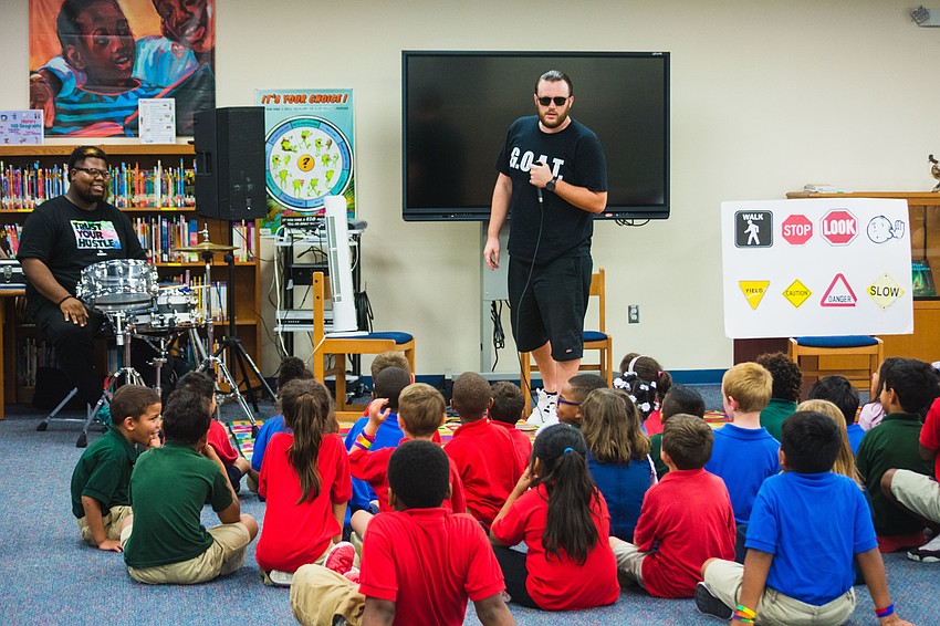 Ryan “Ryanito” Larrañaga, accompanied by drummer Simeon Bishop Moore, performs for students at Alta Vista Elementary.