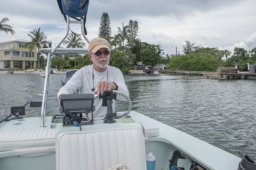 Rusty Chinnis navigates his boat from the northern bayside shore of Longboat Key to Sister Keys