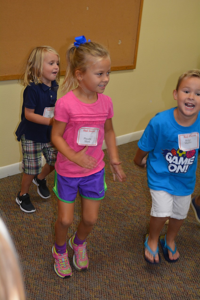 Phoebe Shirk, 5, runs in place for a game.